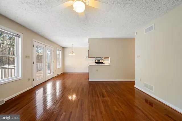 a kitchen with wooden cabinets and a stove top oven
