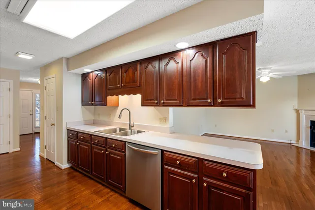 a bathroom with a double vanity sink mirror and toilet