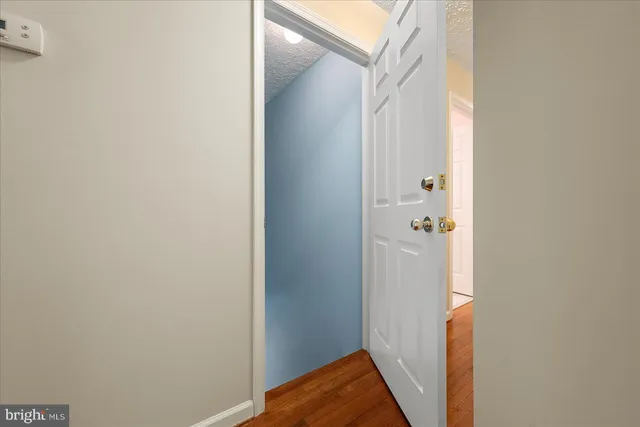 a view of balcony with wooden floor and fence