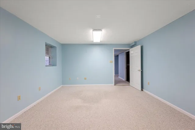 an aerial view of a house with yard swimming pool and lake view