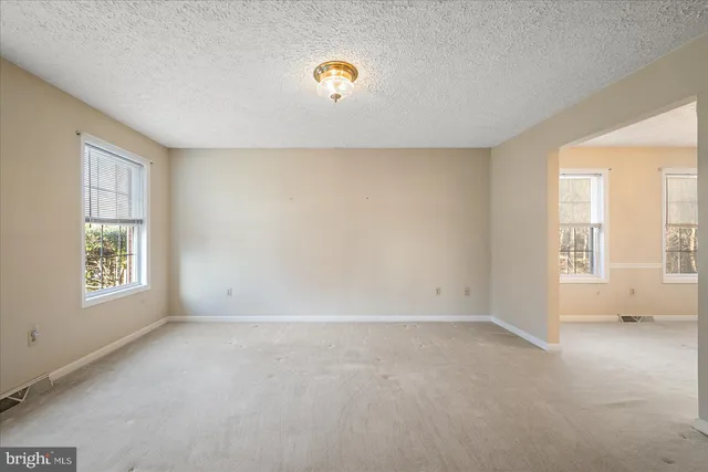 an empty room with windows