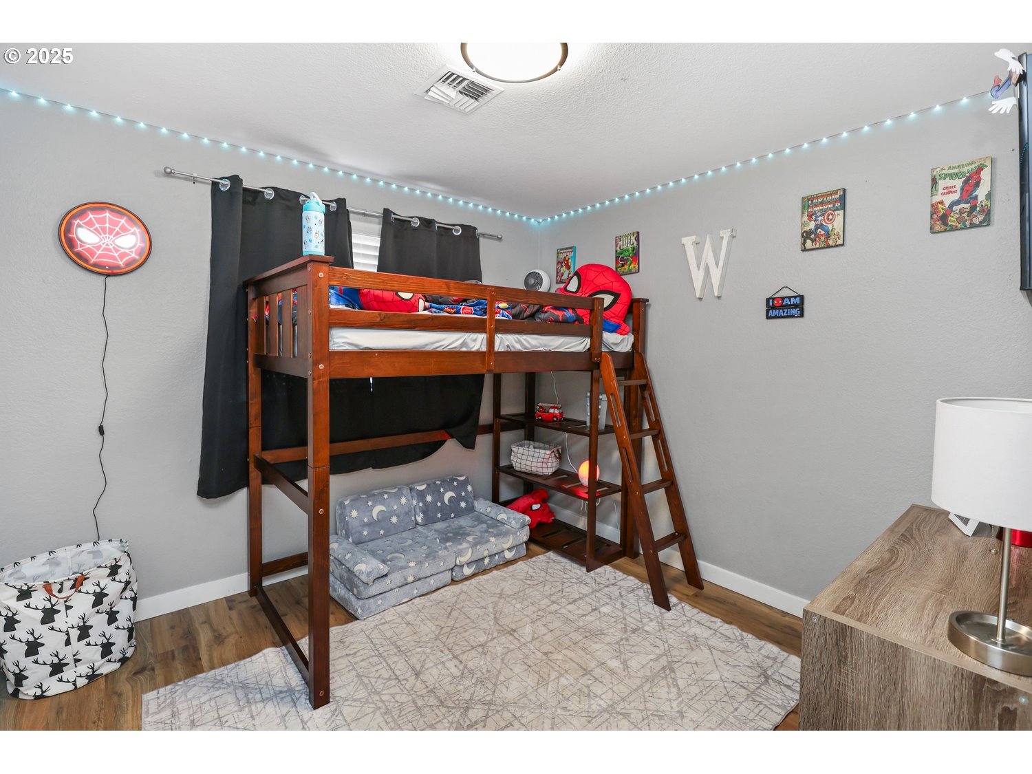 701 South 68th Place Springfield, OR 97478 - Photo 17 of 28 a bedroom with furniture and a bed