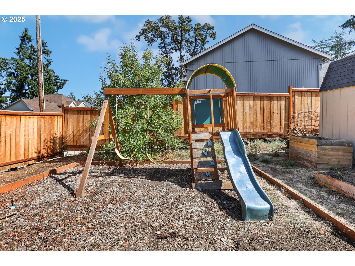701 South 68th Place Springfield, OR 97478 - Photo 28 of 28 a view of a wooden slide with a slide