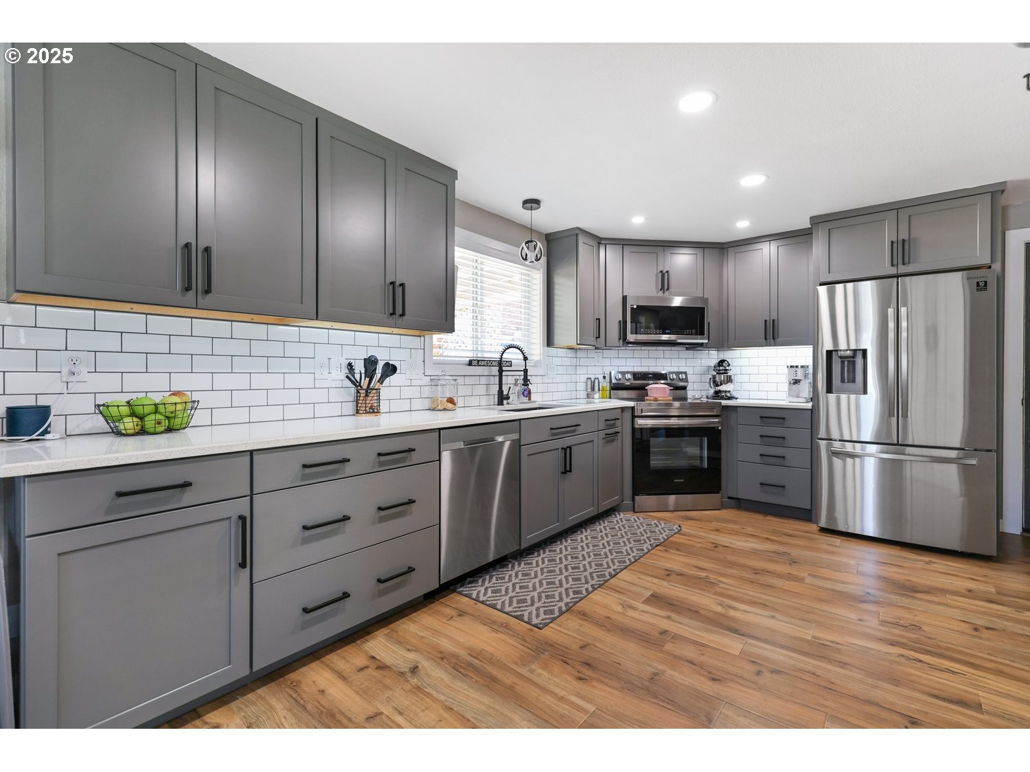 701 South 68th Place Springfield, OR 97478 - Photo 6 of 28 a kitchen with granite countertop stainless steel appliances and wooden cabinets