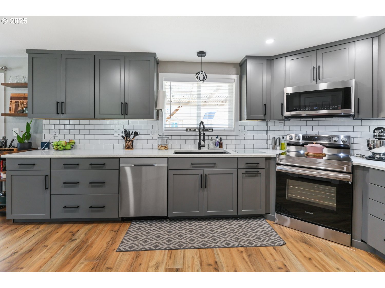 701 South 68th Place Springfield, OR 97478 - Photo 8 of 28 a kitchen with a sink stove and microwave