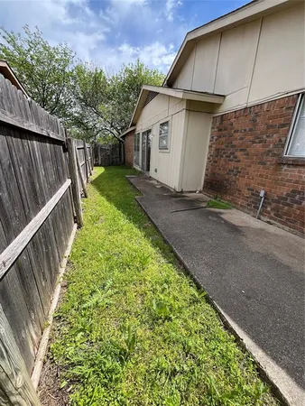 a view of a back yard of the house
