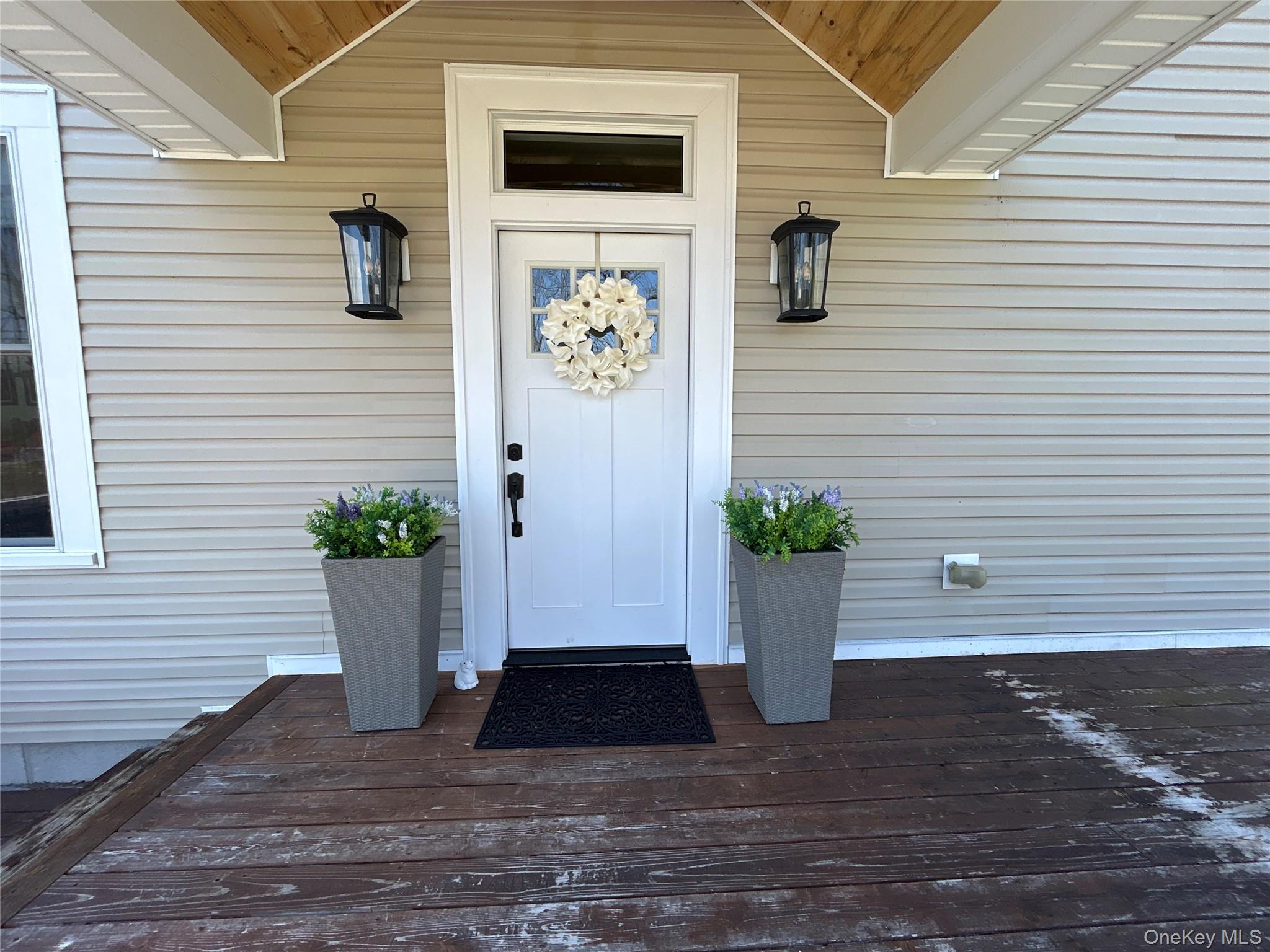 382 Sharon Station Road Amenia, NY 12501 - Photo 2 of 21 a view of a entryway of the house with potted plants