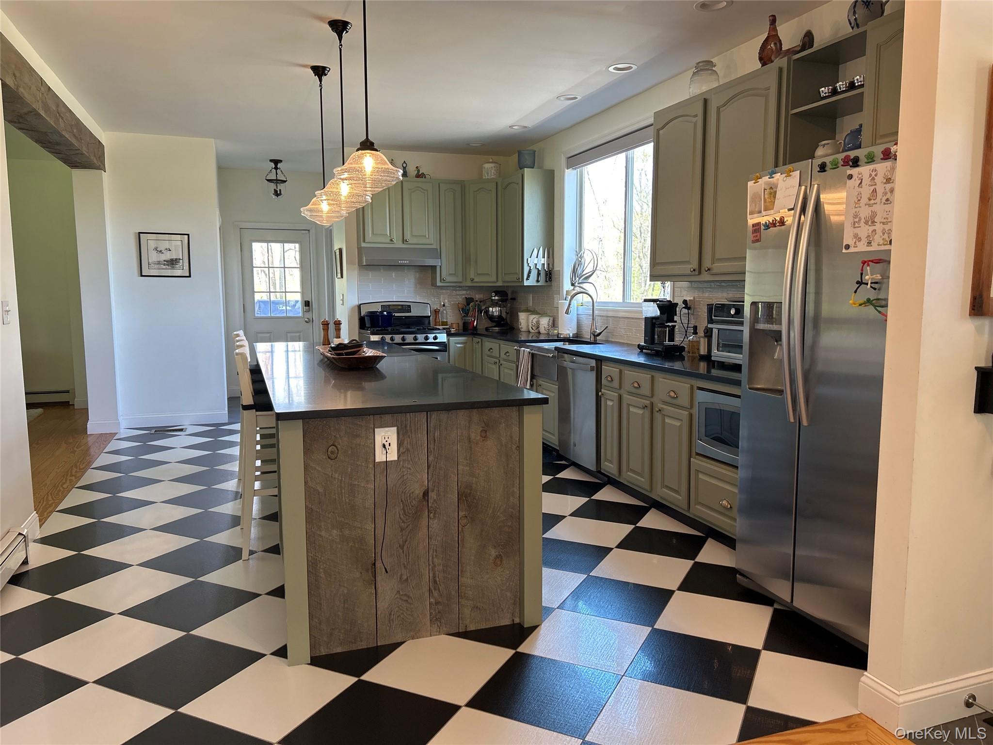 382 Sharon Station Road Amenia, NY 12501 - Photo 8 of 21 a kitchen with a checkered floor and a kitchen island