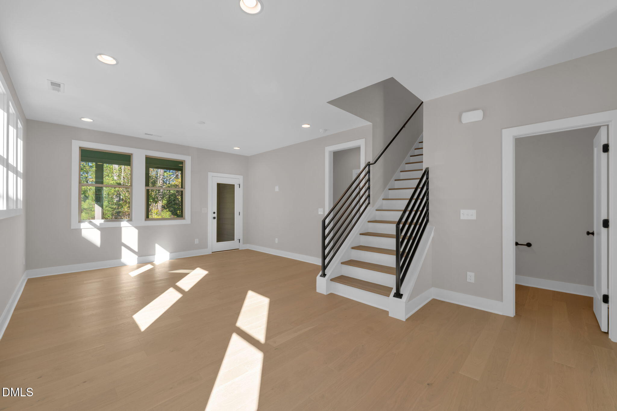 974 Double Helix Road Apex, NC 27523 - Photo 10 of 52 a view of an empty room with stairs and ventilation
