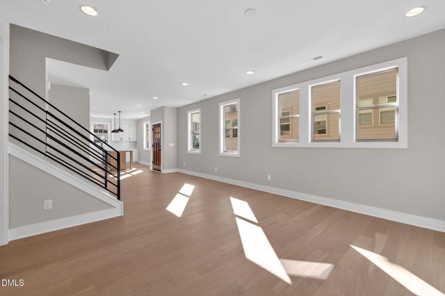 a view of an entryway with wooden floor and windows
