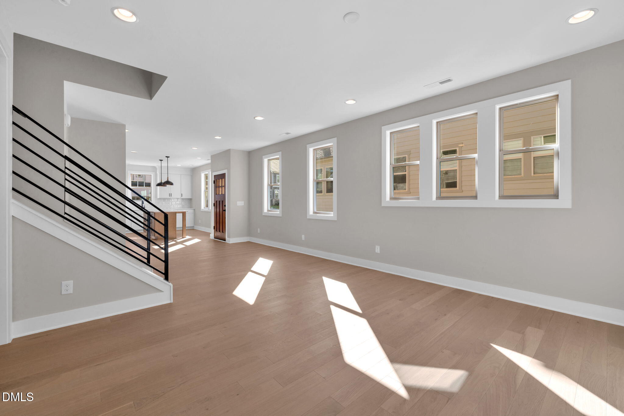 974 Double Helix Road Apex, NC 27523 - Photo 13 of 52 a view of an entryway with wooden floor and windows