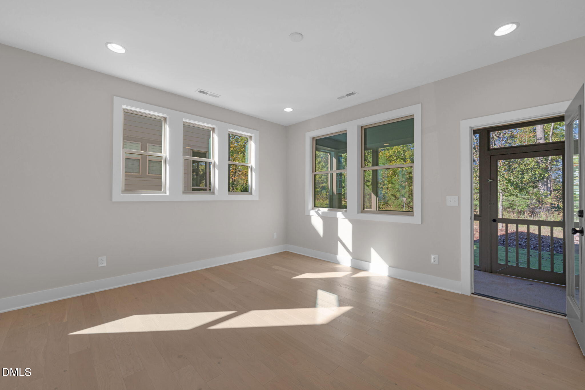 974 Double Helix Road Apex, NC 27523 - Photo 15 of 52 an empty room with windows