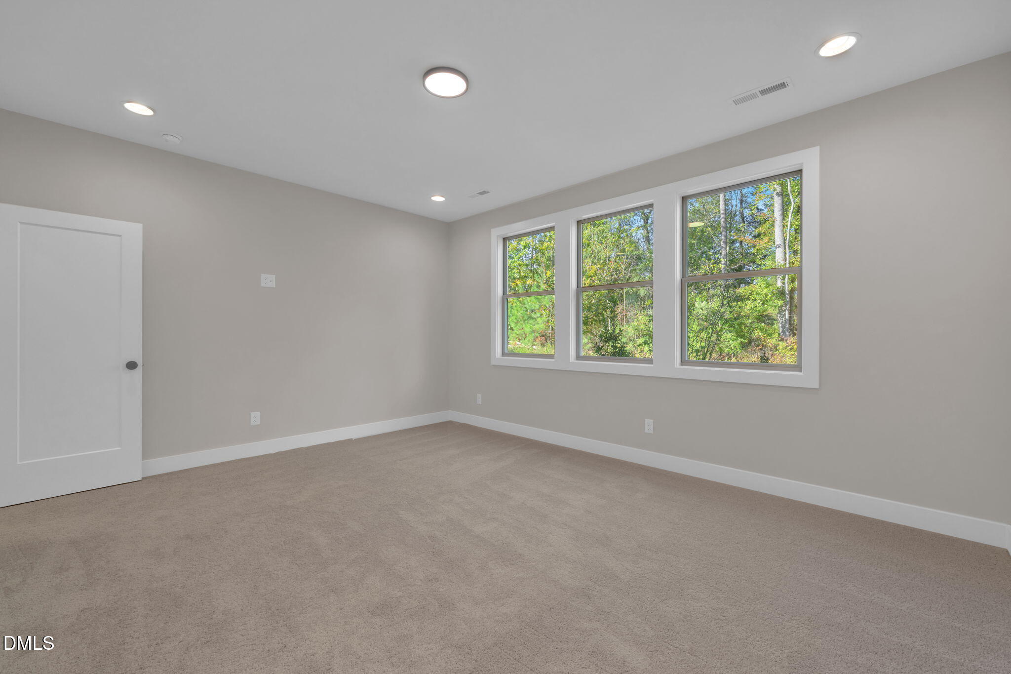 974 Double Helix Road Apex, NC 27523 - Photo 18 of 52 an empty room with windows