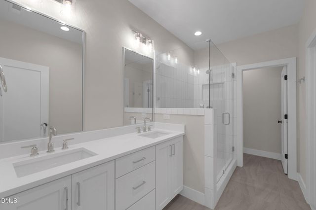 a bathroom with double sink and a mirror