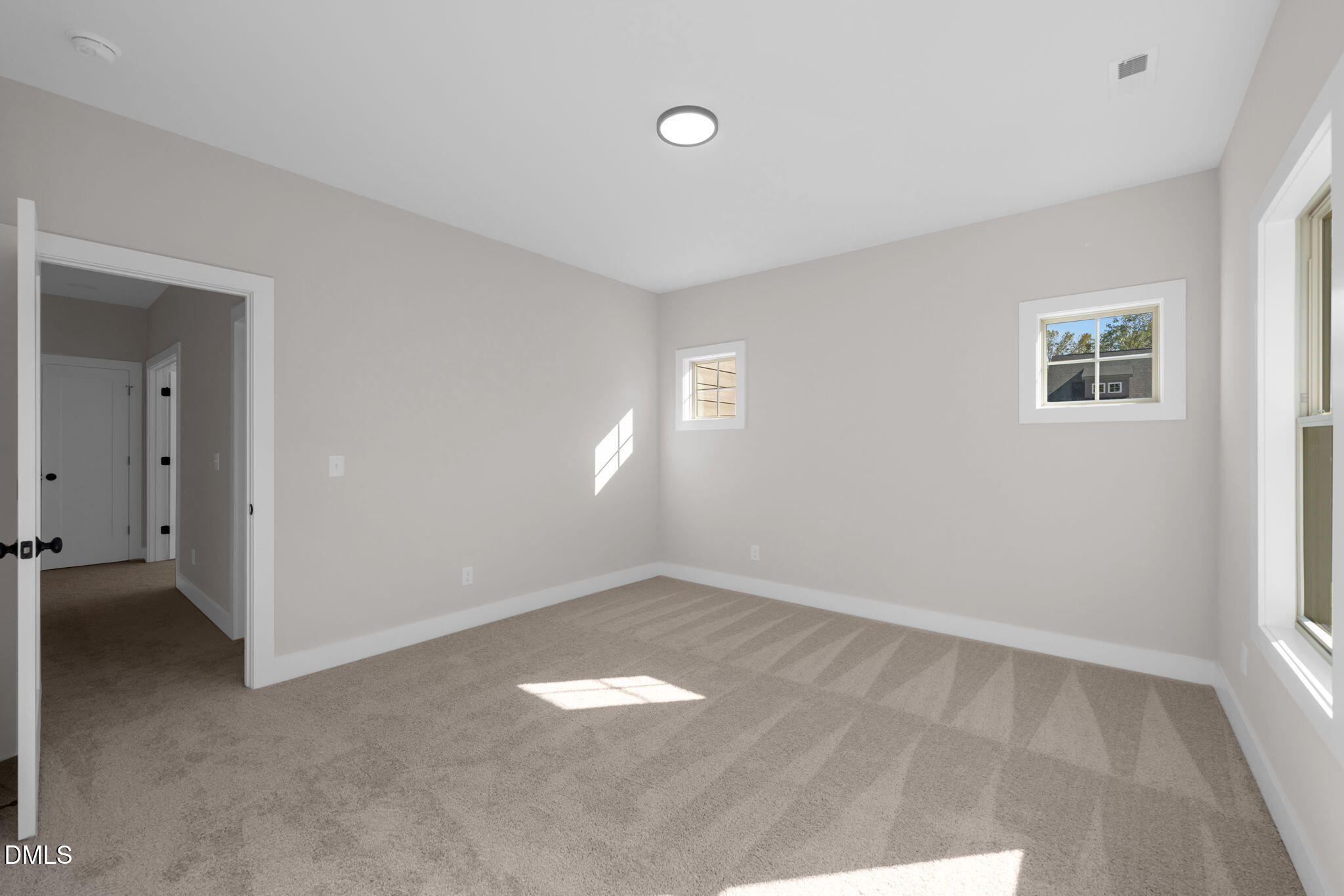 974 Double Helix Road Apex, NC 27523 - Photo 30 of 52 an empty room with windows