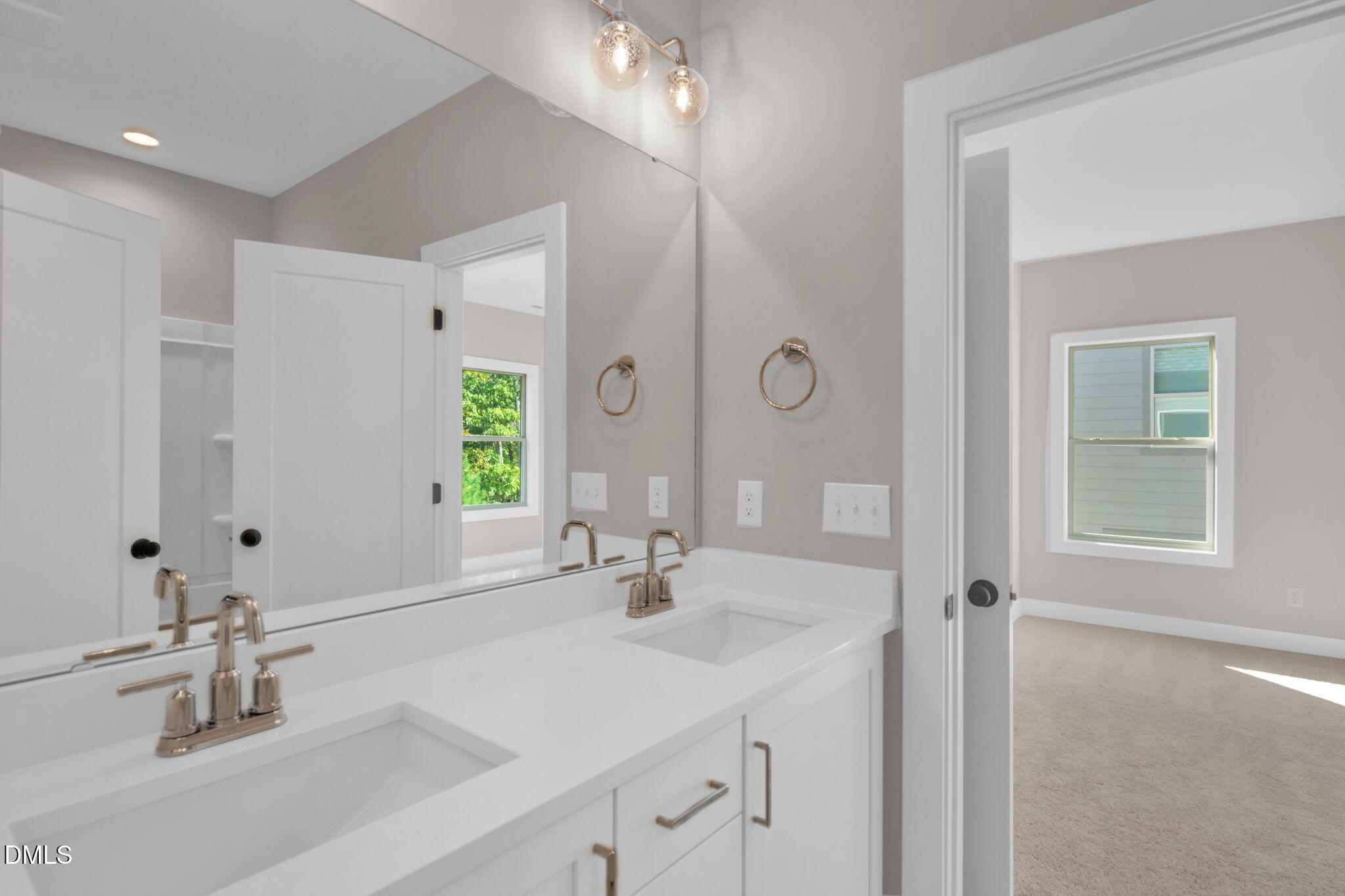 974 Double Helix Road Apex, NC 27523 - Photo 37 of 52 a bathroom with a sink and a mirror