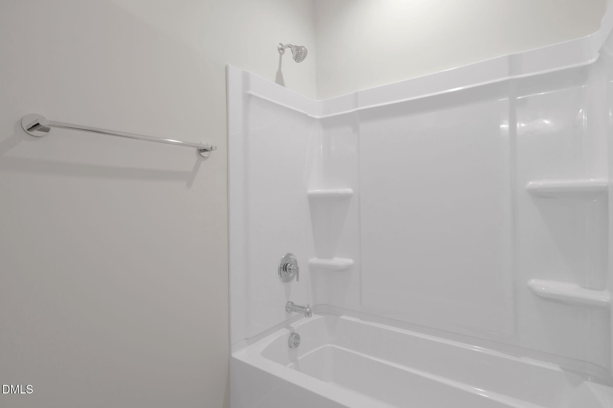 974 Double Helix Road Apex, NC 27523 - Photo 38 of 52 a bathroom with a bathtub and shower