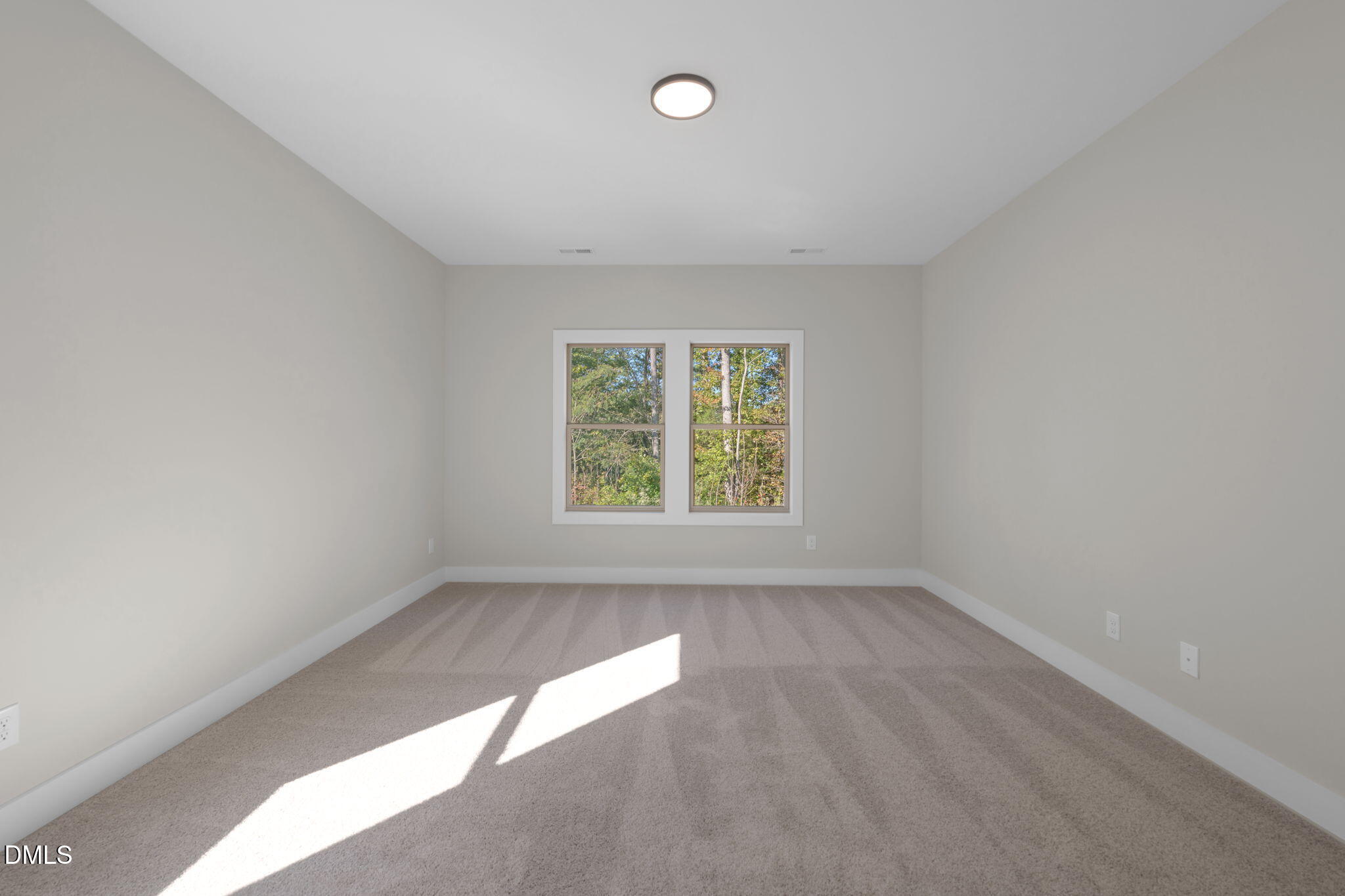 974 Double Helix Road Apex, NC 27523 - Photo 39 of 52 an empty room with windows