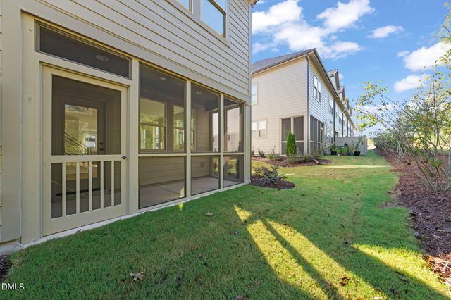 a view of a house with a yard and plants