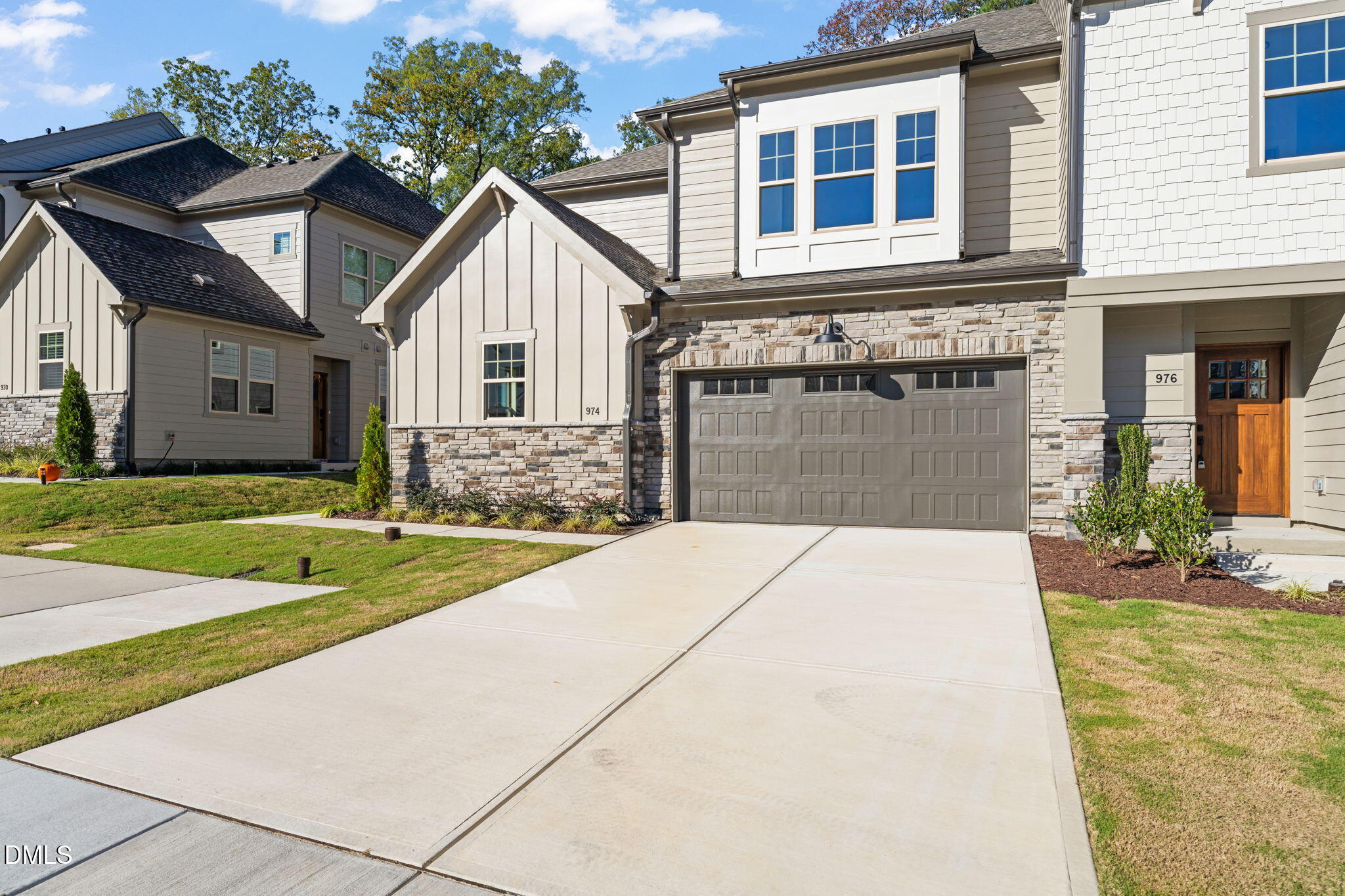 974 Double Helix Road Apex, NC 27523 - Photo 49 of 52 a front view of a house with garden