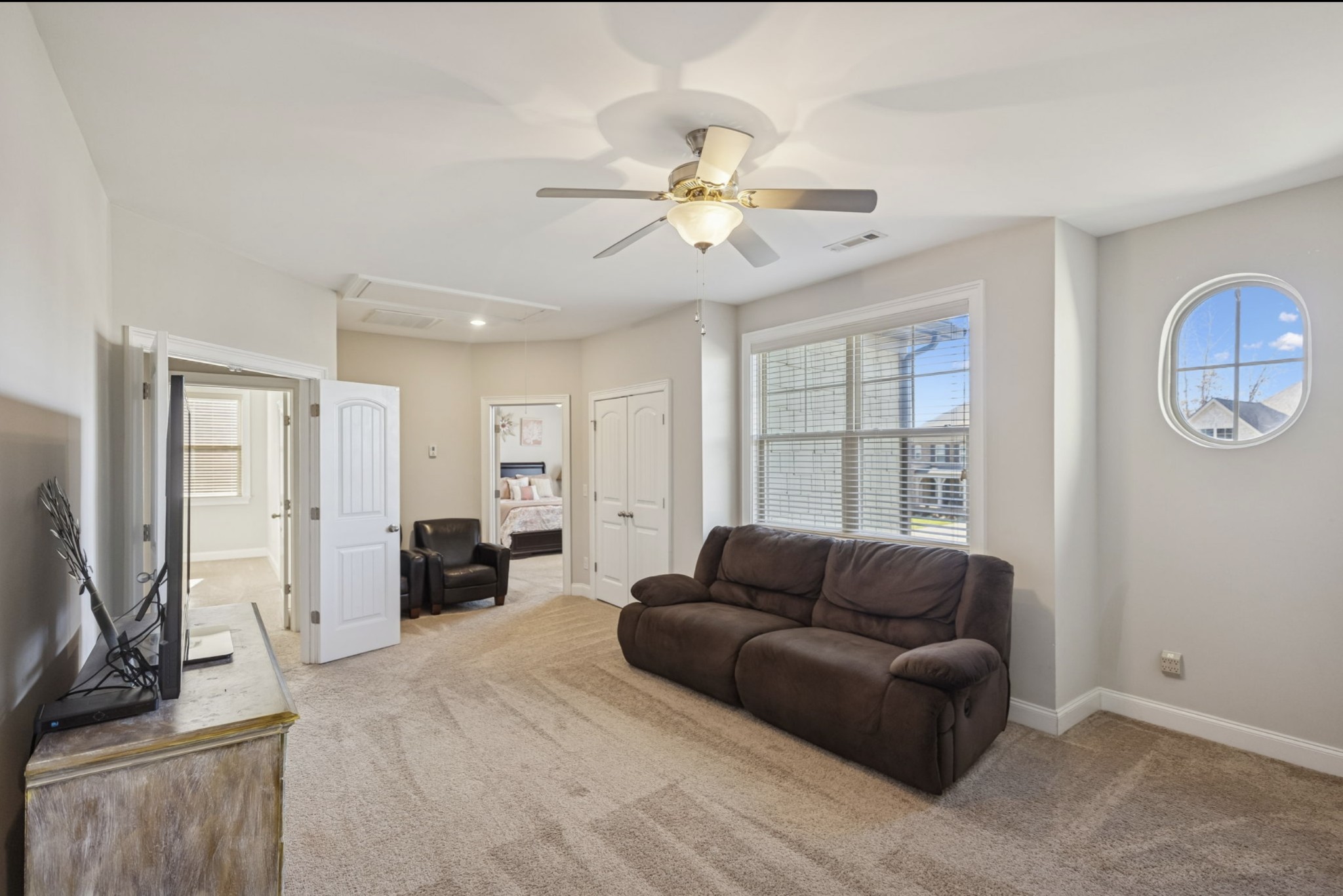 1167 Batbriar Road Murfreesboro, TN 37128 - Photo 13 of 22 a living room with furniture a ceiling fan and a window