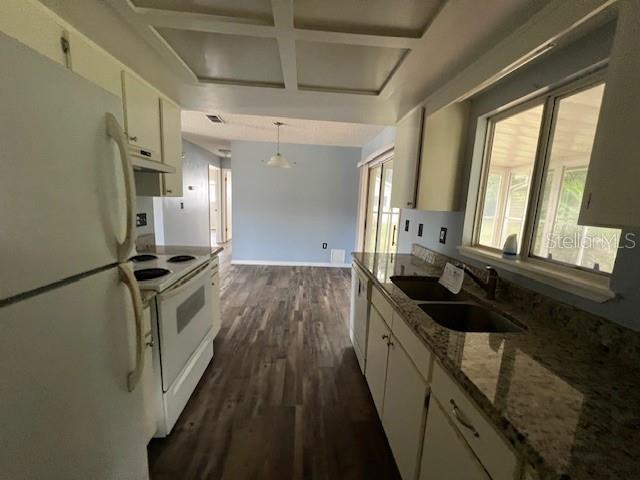 7670 Southwest 112th Lane Ocala, FL 34476 - Photo 12 of 16 a kitchen with a sink a counter top space and stainless steel appliances