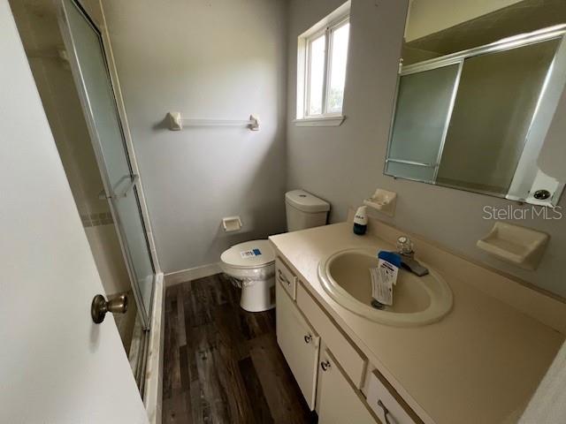 7670 Southwest 112th Lane Ocala, FL 34476 - Photo 16 of 16 a bathroom with a sink and mirror with toilet