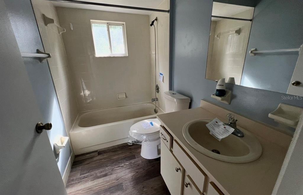 7670 Southwest 112th Lane Ocala, FL 34476 - Photo 7 of 16 a bathroom with a sink toilet and shower