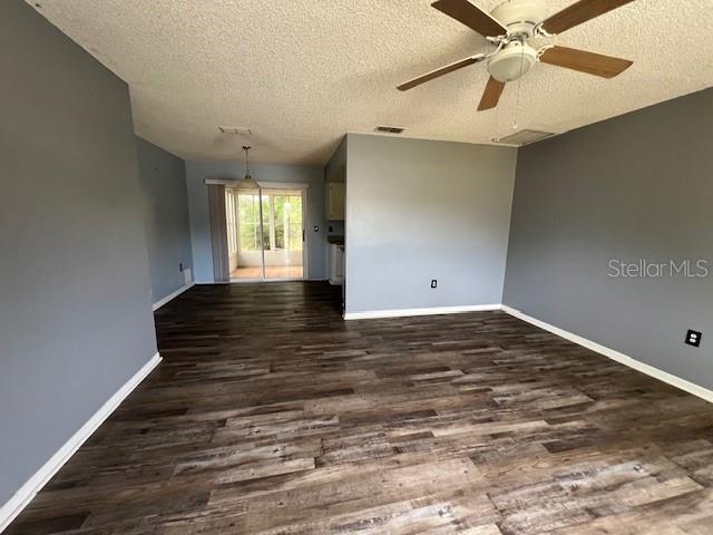 7670 Southwest 112th Lane Ocala, FL 34476 - Photo 10 of 16 an empty room with wooden floor and windows