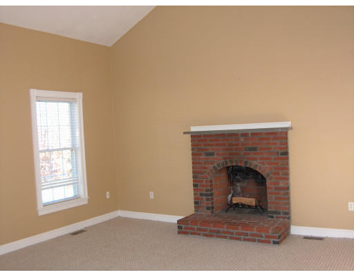 22 Broken Tree Road Medway, MA 02053 - Photo 5 of 7 a living room with furniture and a fireplace