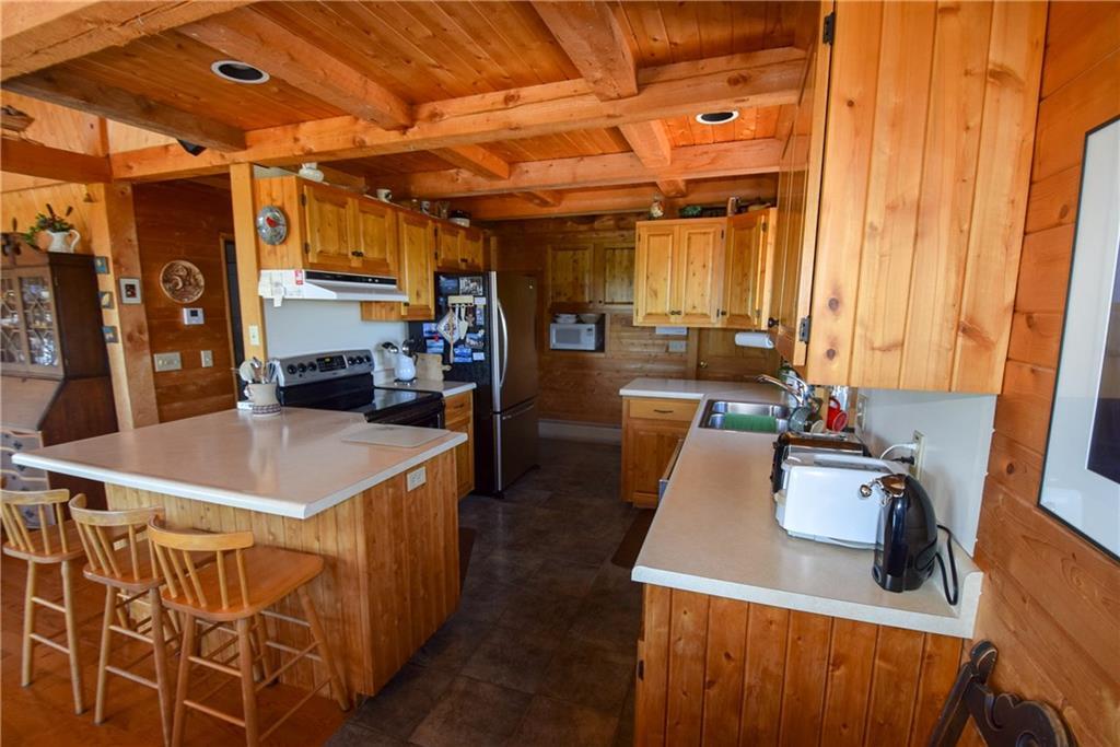 234 Retreat Road Island Falls, ME 04747 - Photo 18 of 35 Breakfast bar with tile flooring and...
