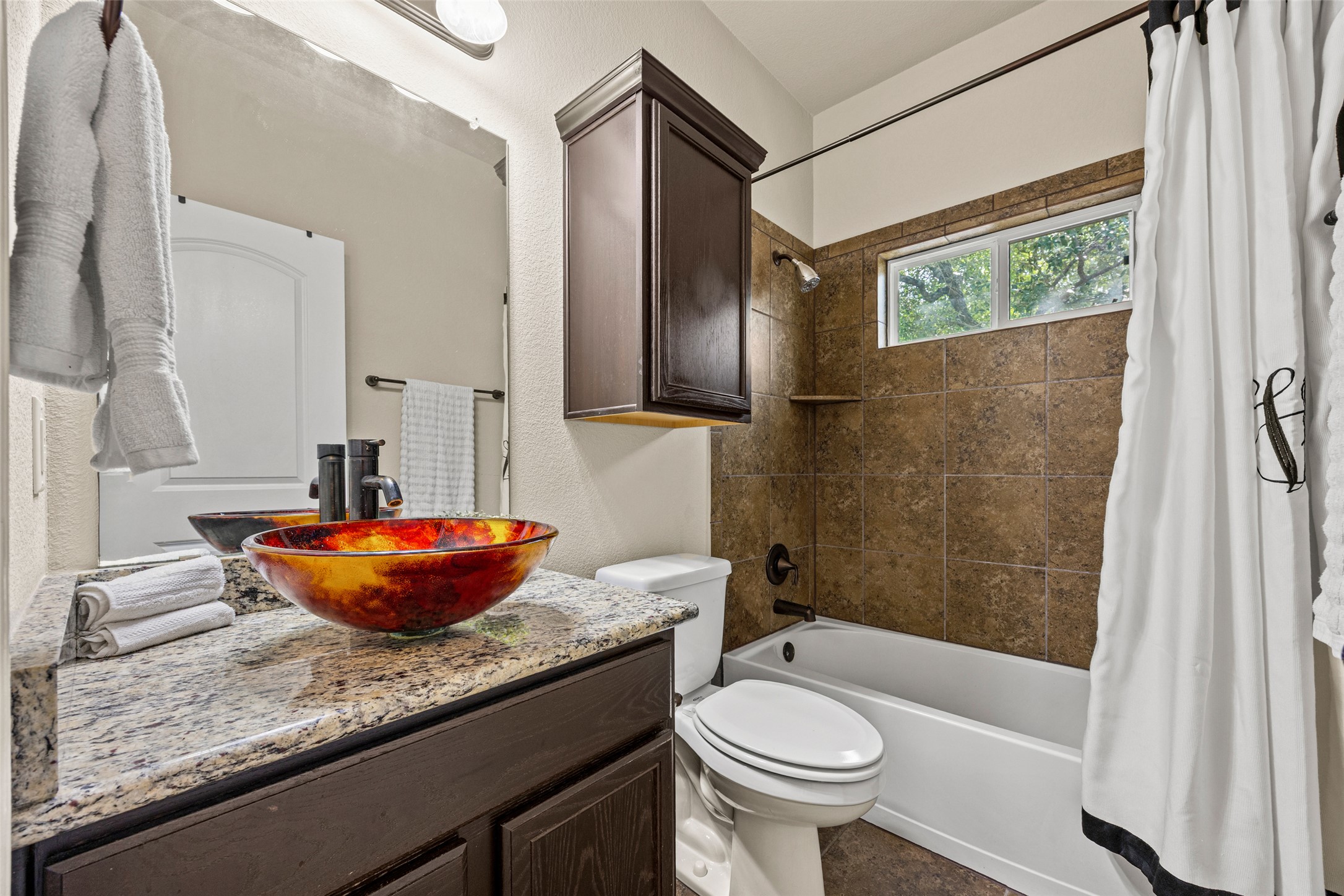 3451 Mayfield Ranch Boulevard, Unit 201 Round Rock, TX 78681 - Photo 10 of 29 a bathroom with a granite countertop sink and a large mirror