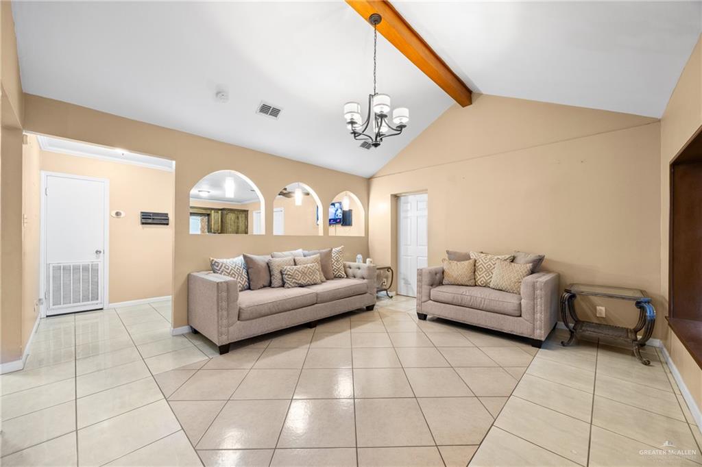 304 South 27th Street McAllen, TX 78501 - Photo 3 of 21 a living room with furniture and a chandelier