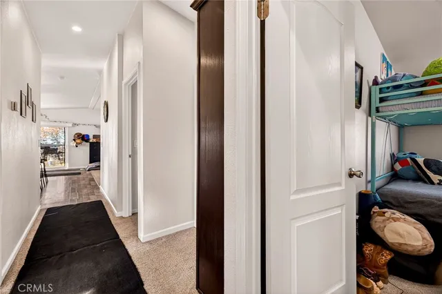a bedroom with furniture and a flat screen tv