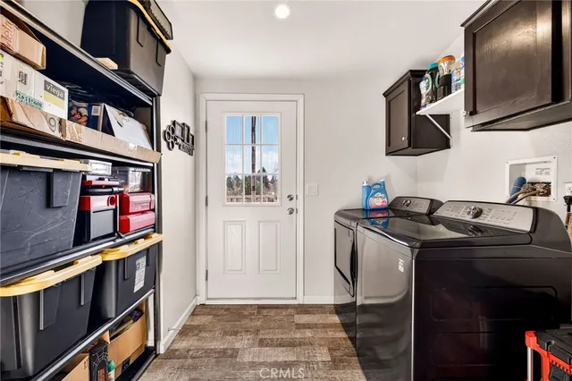 a view of a patio with table and chairs