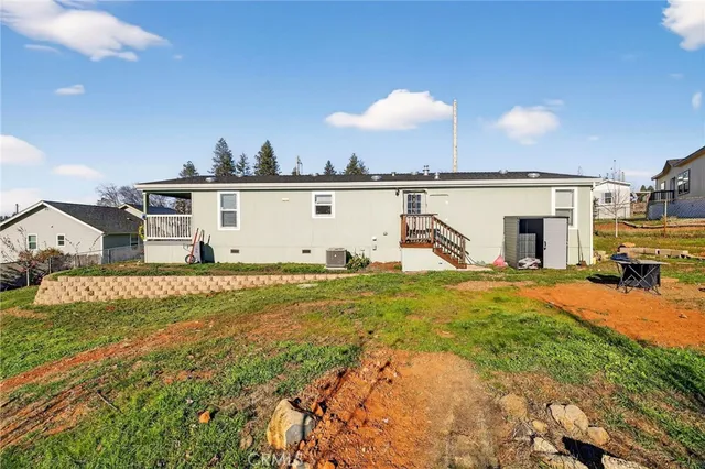 an aerial view of a residential houses with outdoor space