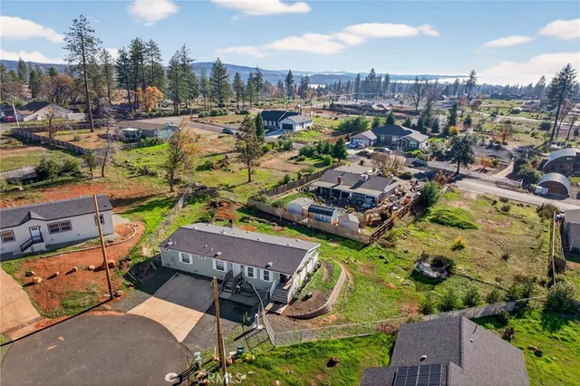 an aerial view of residential houses with outdoor space