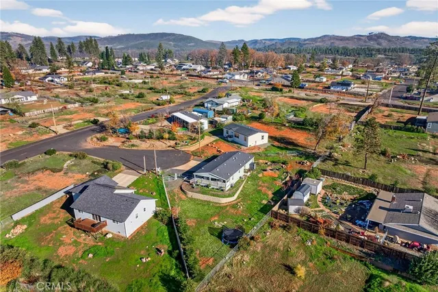 an aerial view of a house with a ocean view