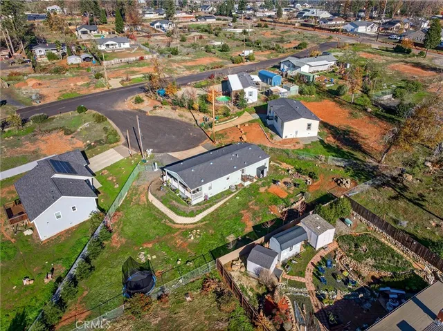 an aerial view of houses with outdoor space