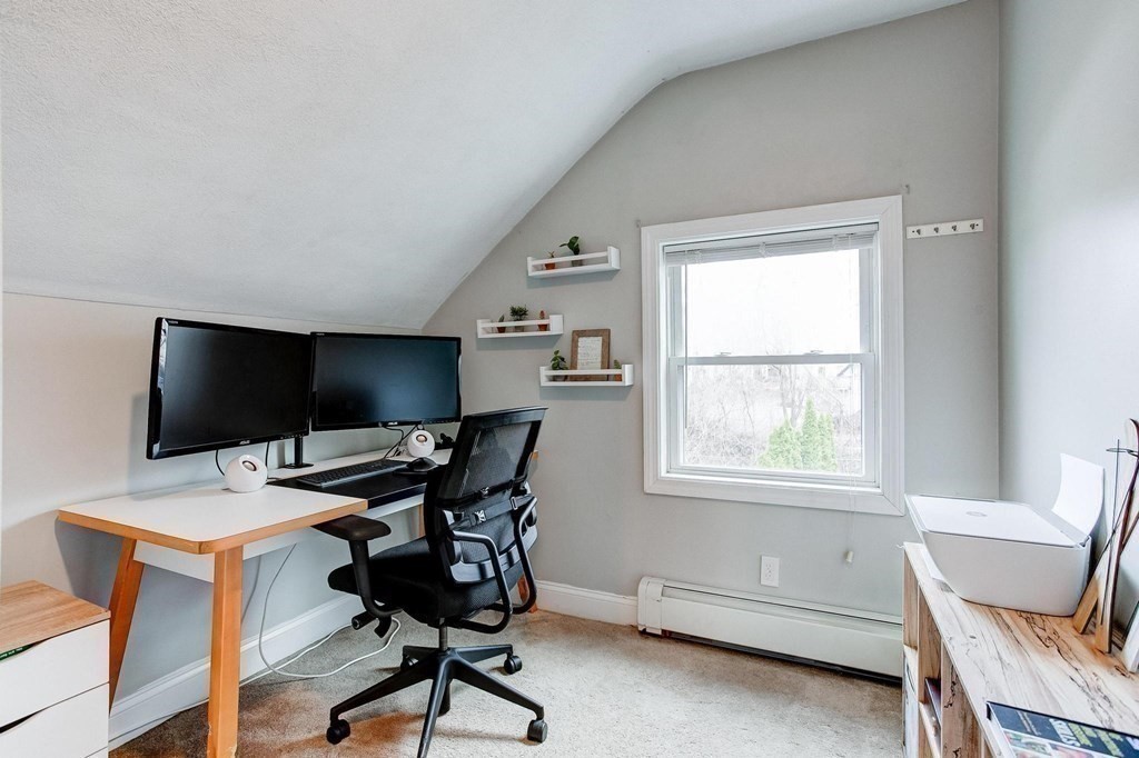 54 Pine Street Stoneham, MA 02180 - Photo 17 of 30 a view of a workspace with furniture and a window