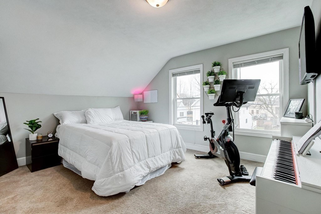 54 Pine Street Stoneham, MA 02180 - Photo 18 of 30 a bed room with a bed tv and a window