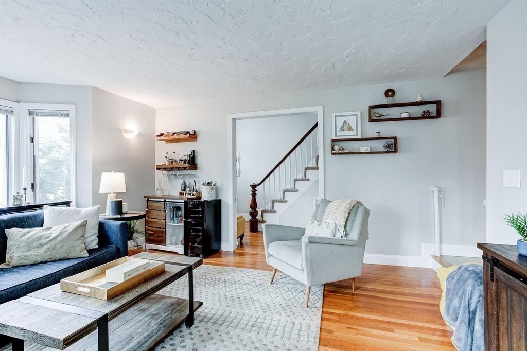 54 Pine Street Stoneham, MA 02180 - Photo 2 of 30 a living room with furniture and wooden floor