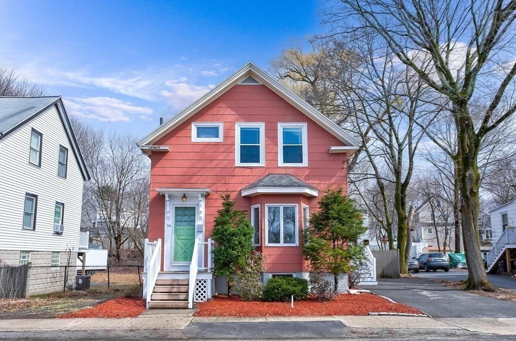 54 Pine Street Stoneham, MA 02180 - Photo 25 of 30 a front view of a house with a yard