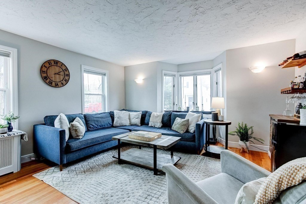 54 Pine Street Stoneham, MA 02180 - Photo 3 of 30 a living room with furniture and a large window