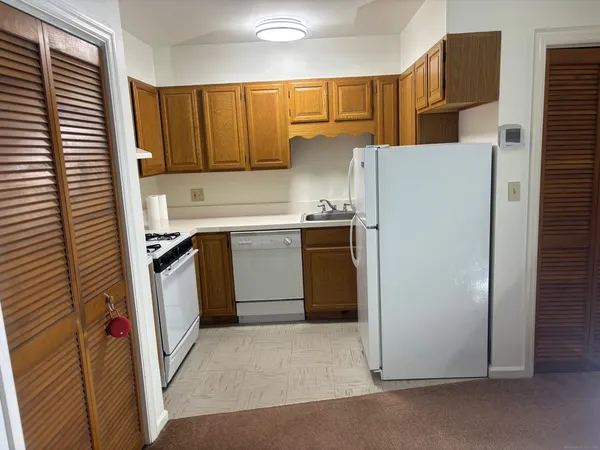 a utility room with sink dryer and washer
