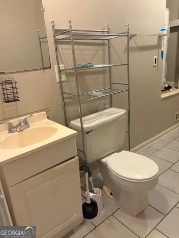 a bathroom with a toilet and a sink
