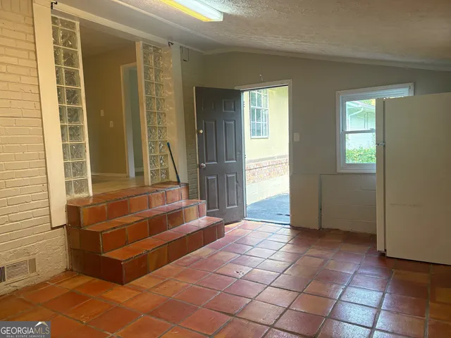 a view of a backyard with large trees