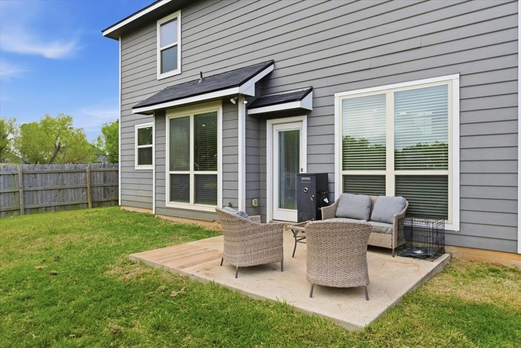 10701 Kestrel Court Waco, TX 76708 - Photo 19 of 37 Rear view of property with a patio area and outdoor seating