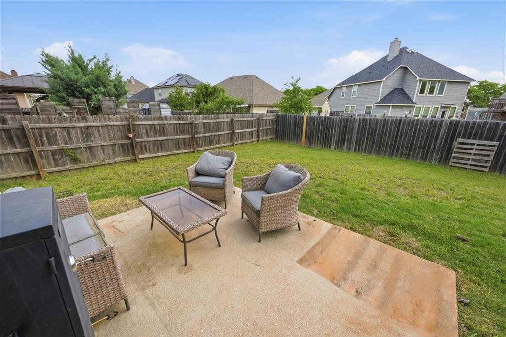 10701 Kestrel Court Waco, TX 76708 - Photo 20 of 37 Fenced backyard with a patio and a residential view