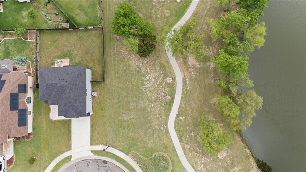 10701 Kestrel Court Waco, TX 76708 - Photo 28 of 37 Direct overhead aerial view of home next to pond and walking area